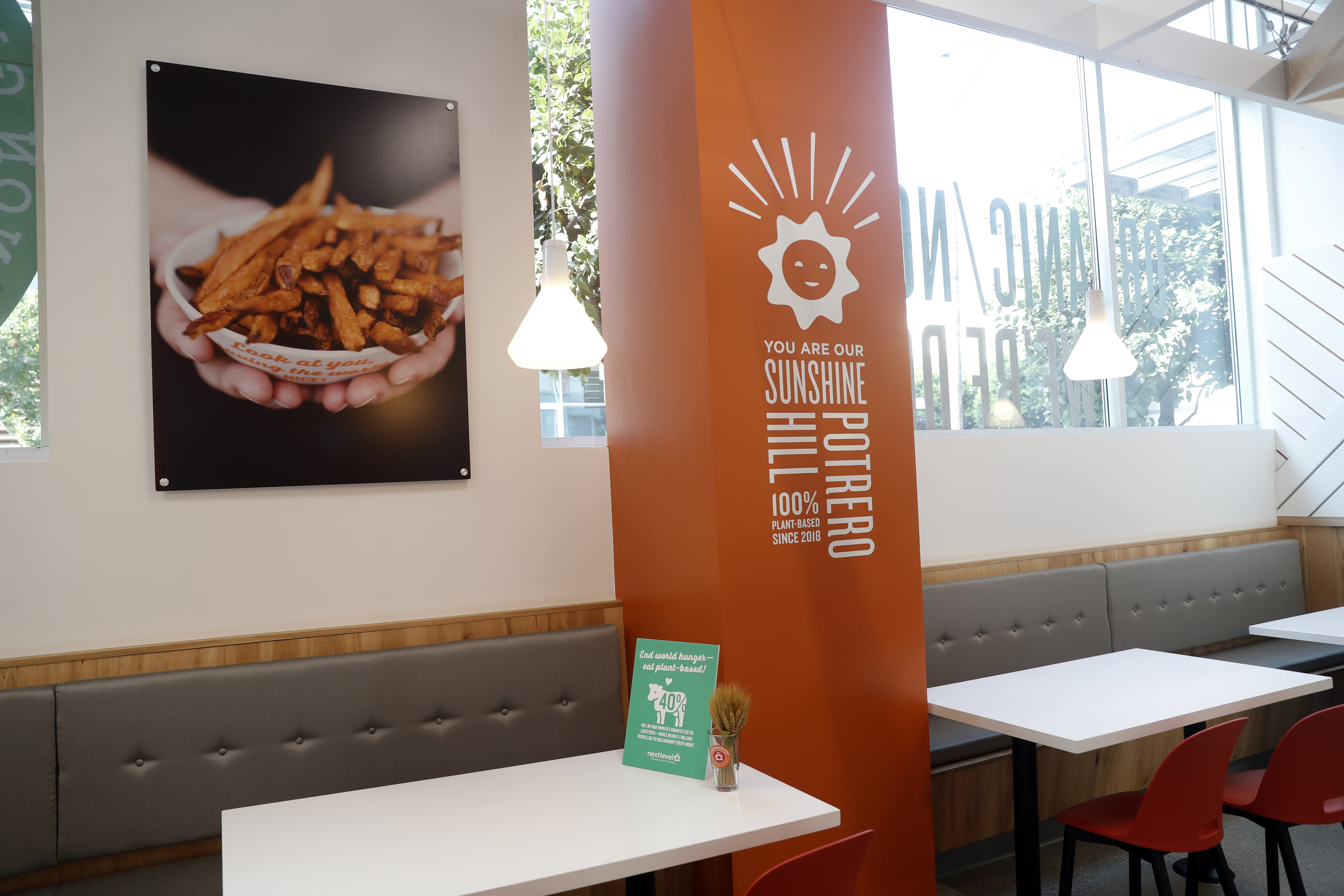 a bedroom with a computer on a table
