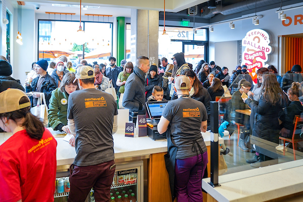 a group of people standing in a room