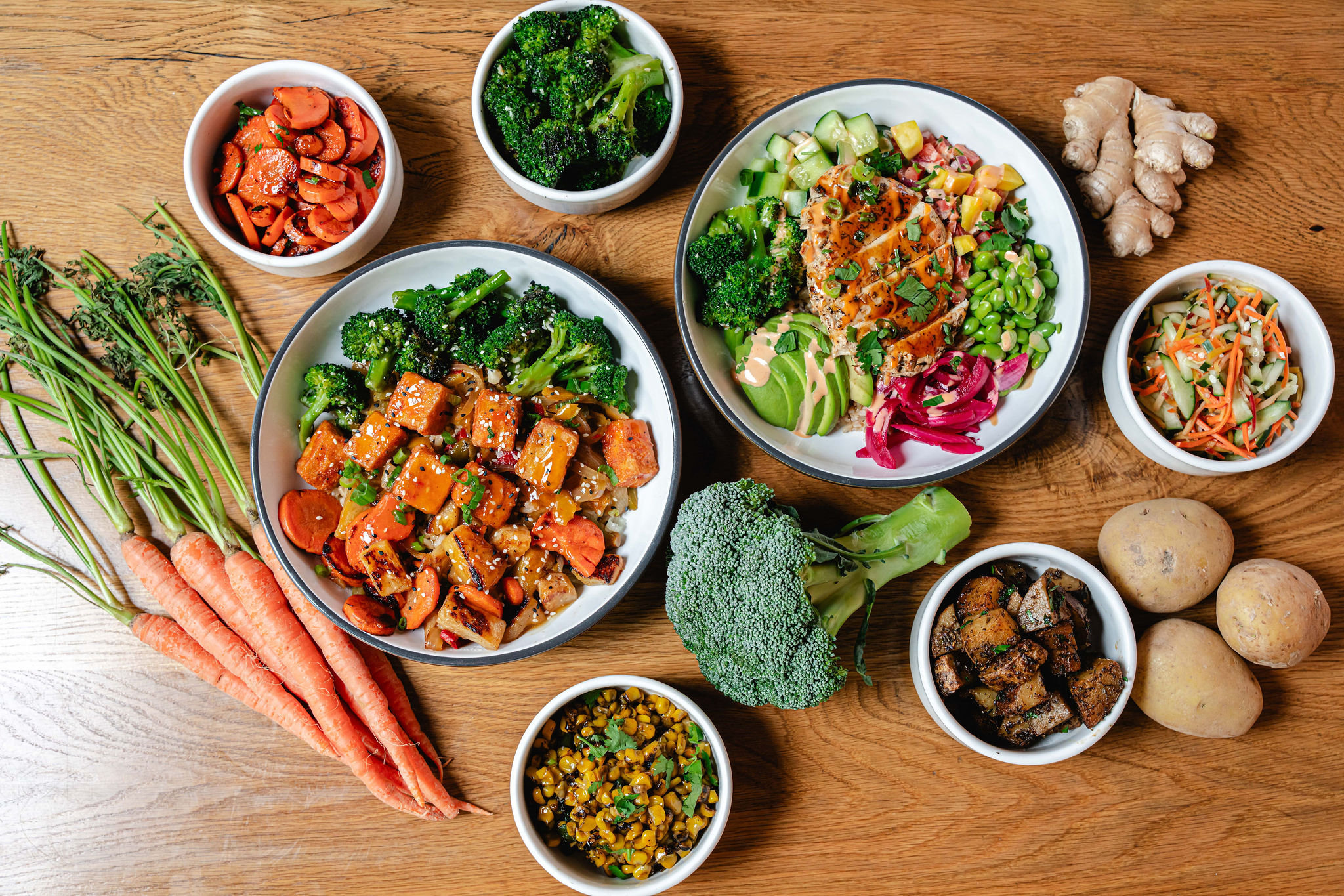 bowls of food with fresh vegetables