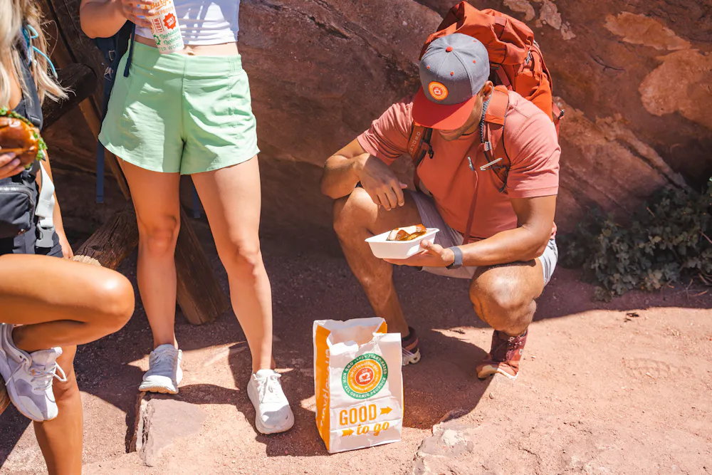 people eating burgers and drinking soda