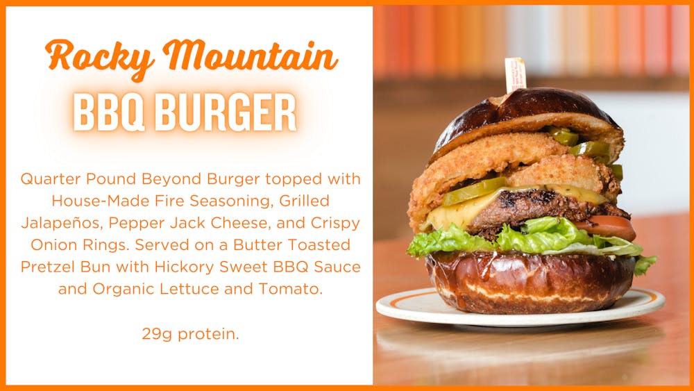Rocky Mountain BBQ Burger: Quarter Pound Beyond Burger topped with House-Made Fire Seasoning, Grilled Jalapenos, Pepper Jack Cheese, and Crispy Onion Rings. Served on a Butter Toasted Pretzel Bun with Hickory Sweet BBQ Sauce and Organic Lettuce and Tomato. 29g protein. 