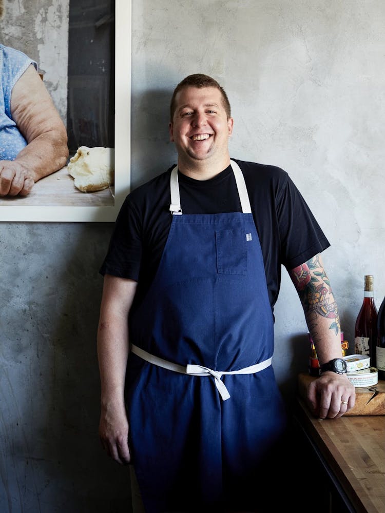 a man standing in front of a plate of food