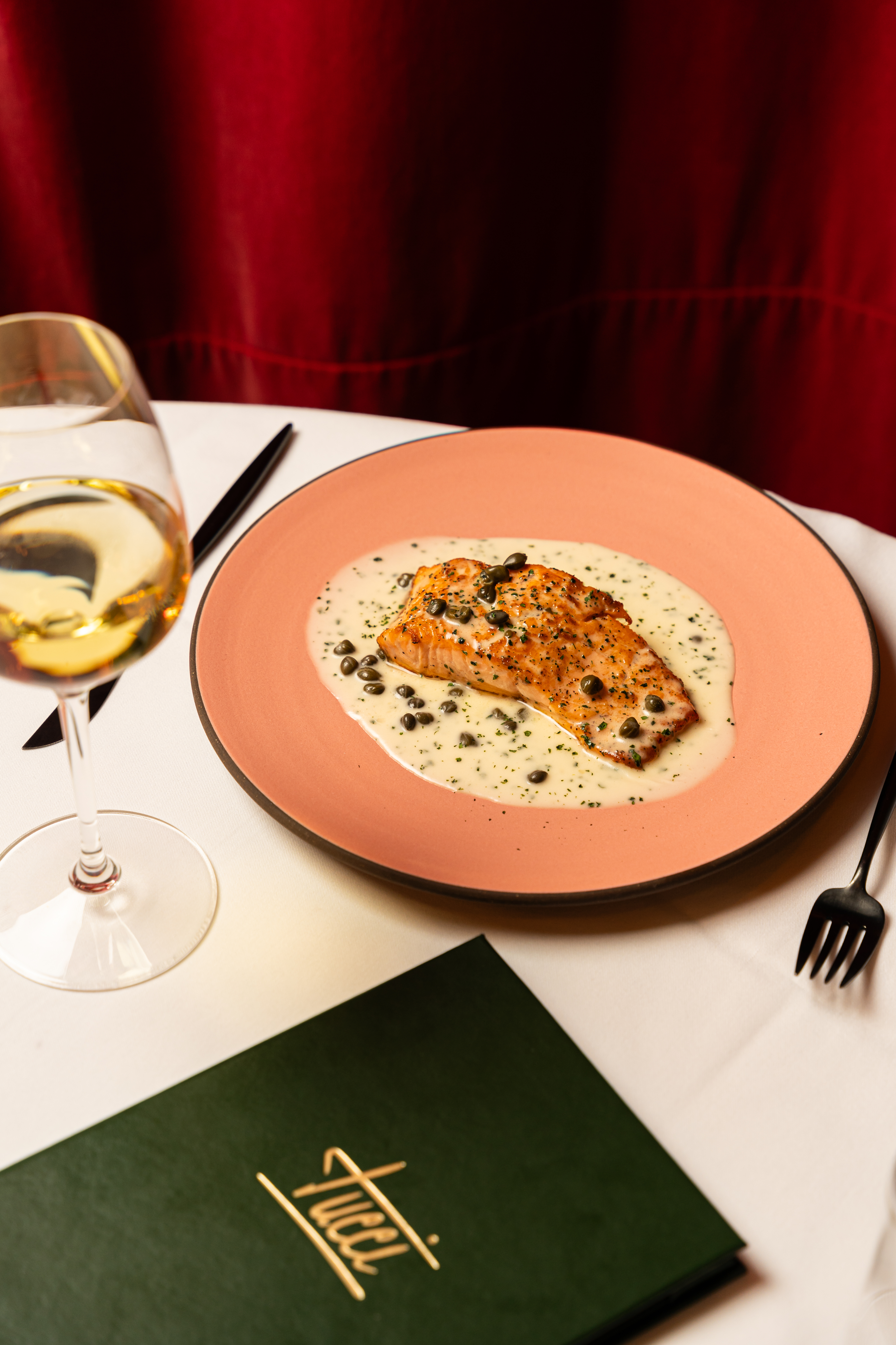 Tucci NYC exterior at dusk on Broadway in NoHo Manhattan for corporate dining and business dinners