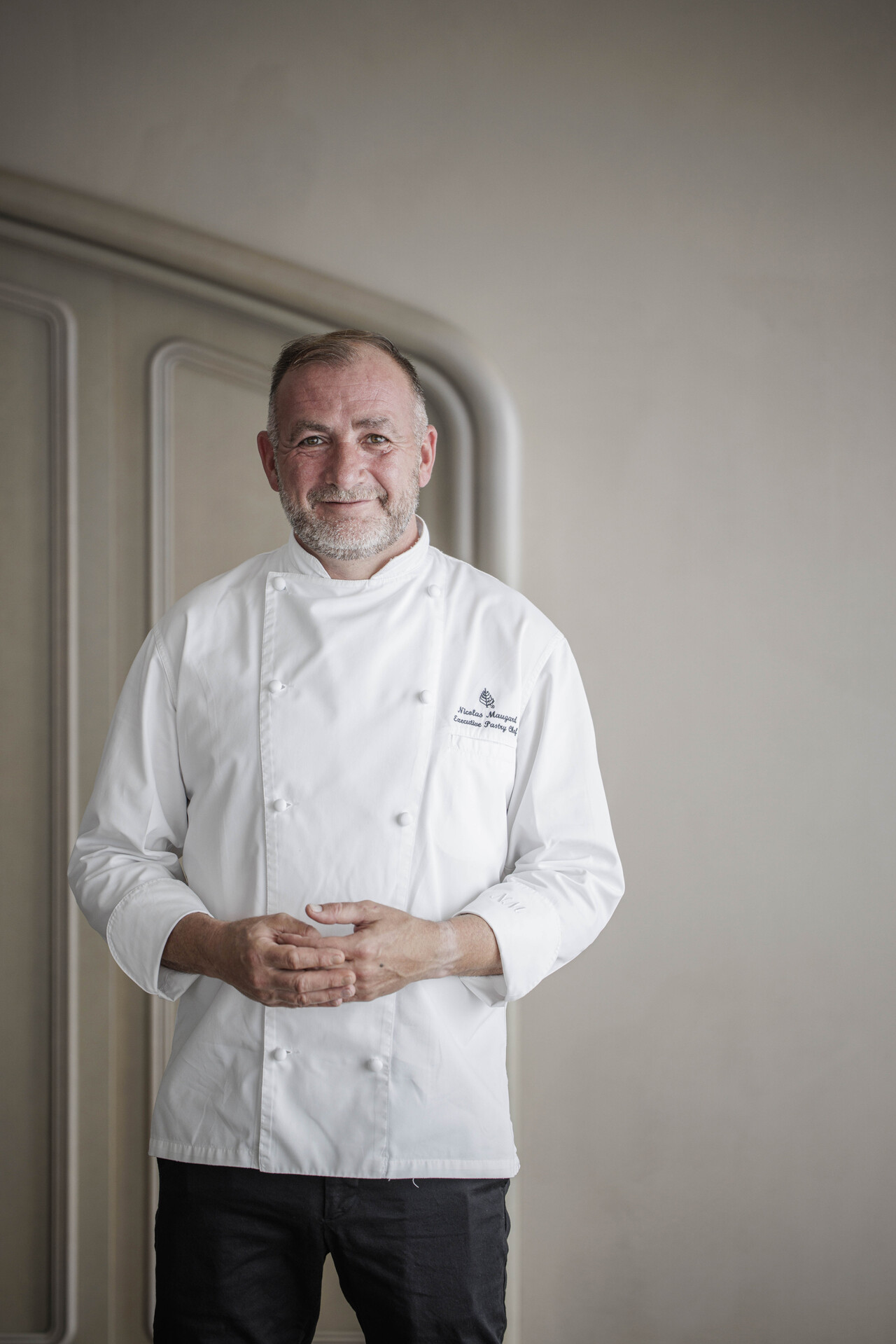 a man in a white coat