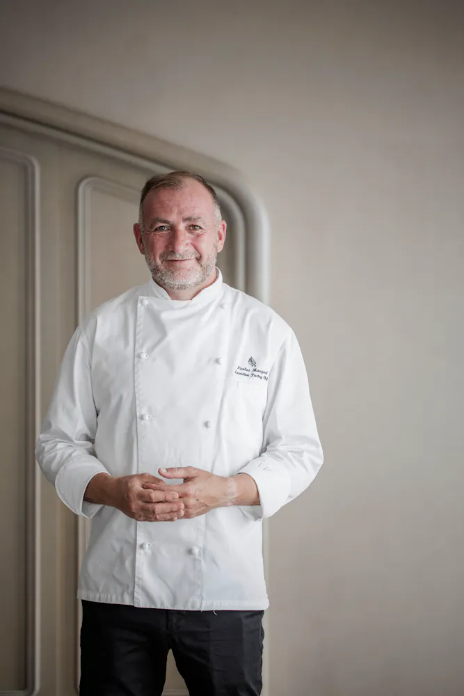 a man in a white coat
