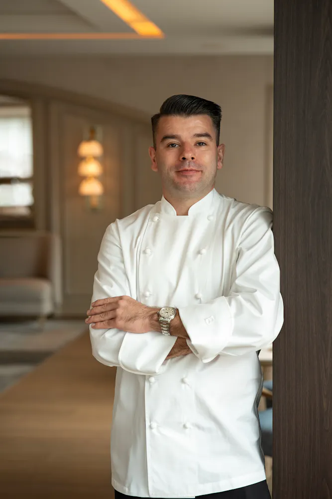 a man in a white chef coat