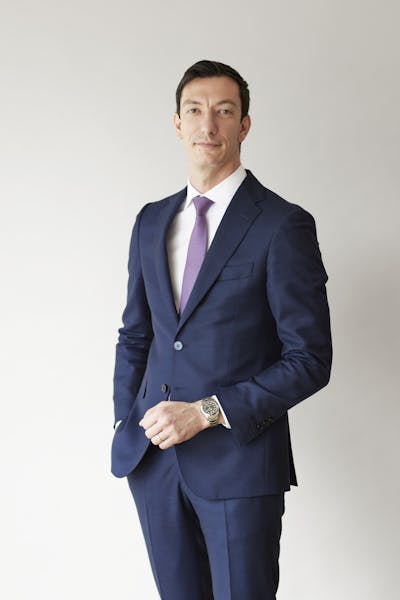 a man wearing a suit and tie