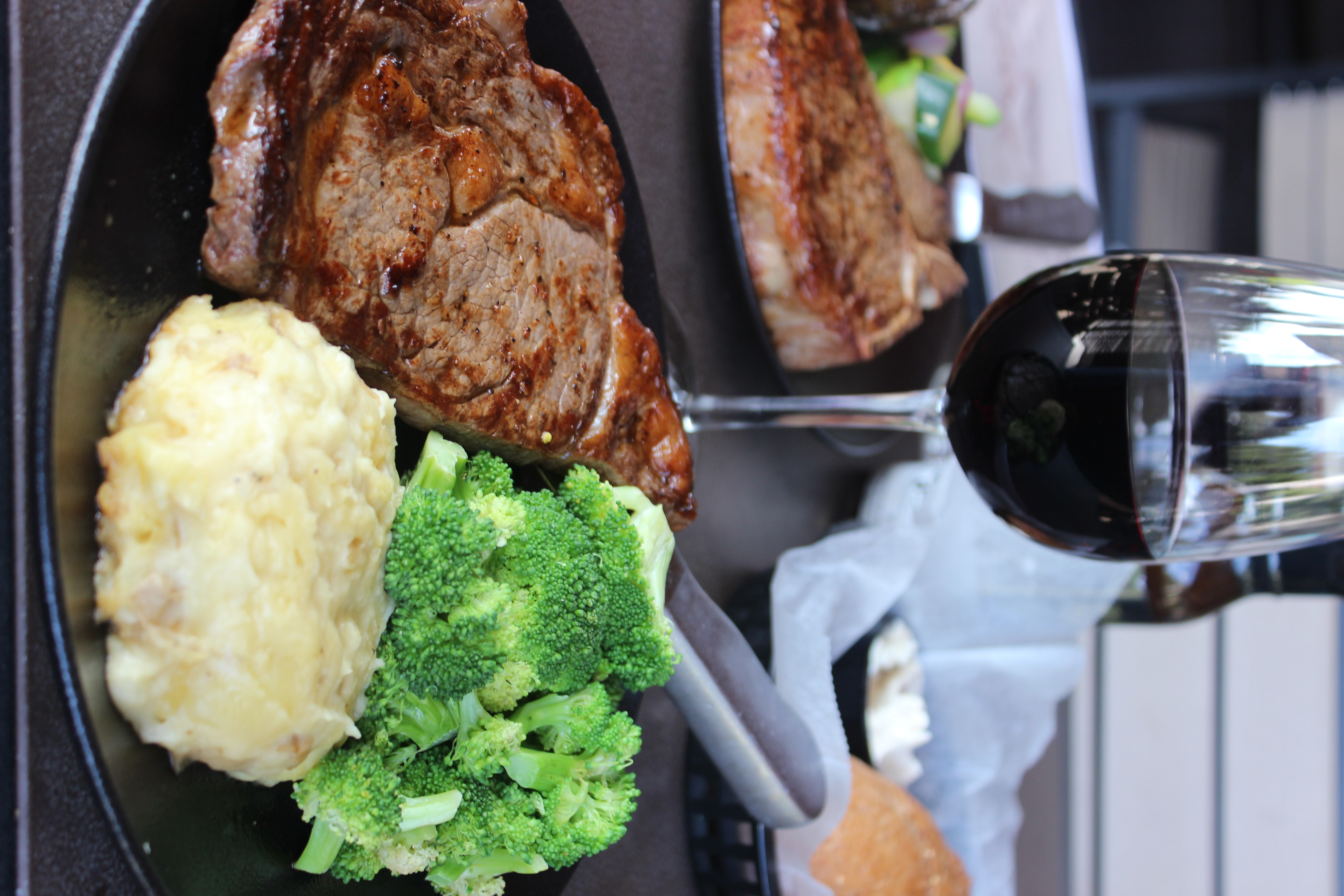 a plate of steak and vegetables