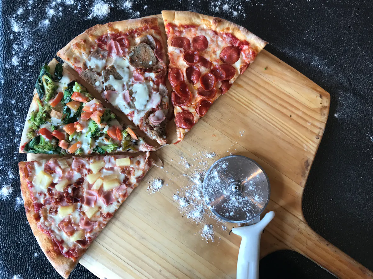 a pizza sitting on a wooden cutting board