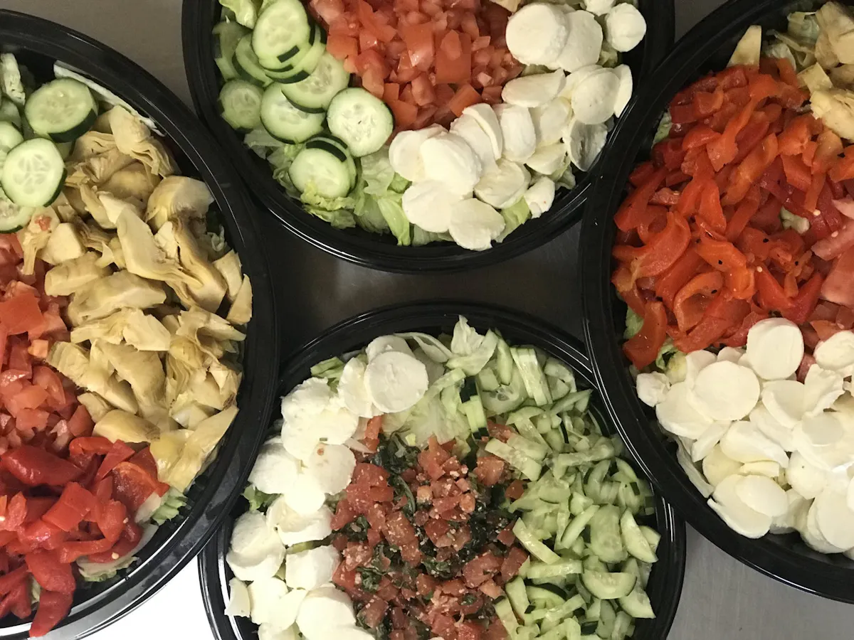 an array of four salad bowls