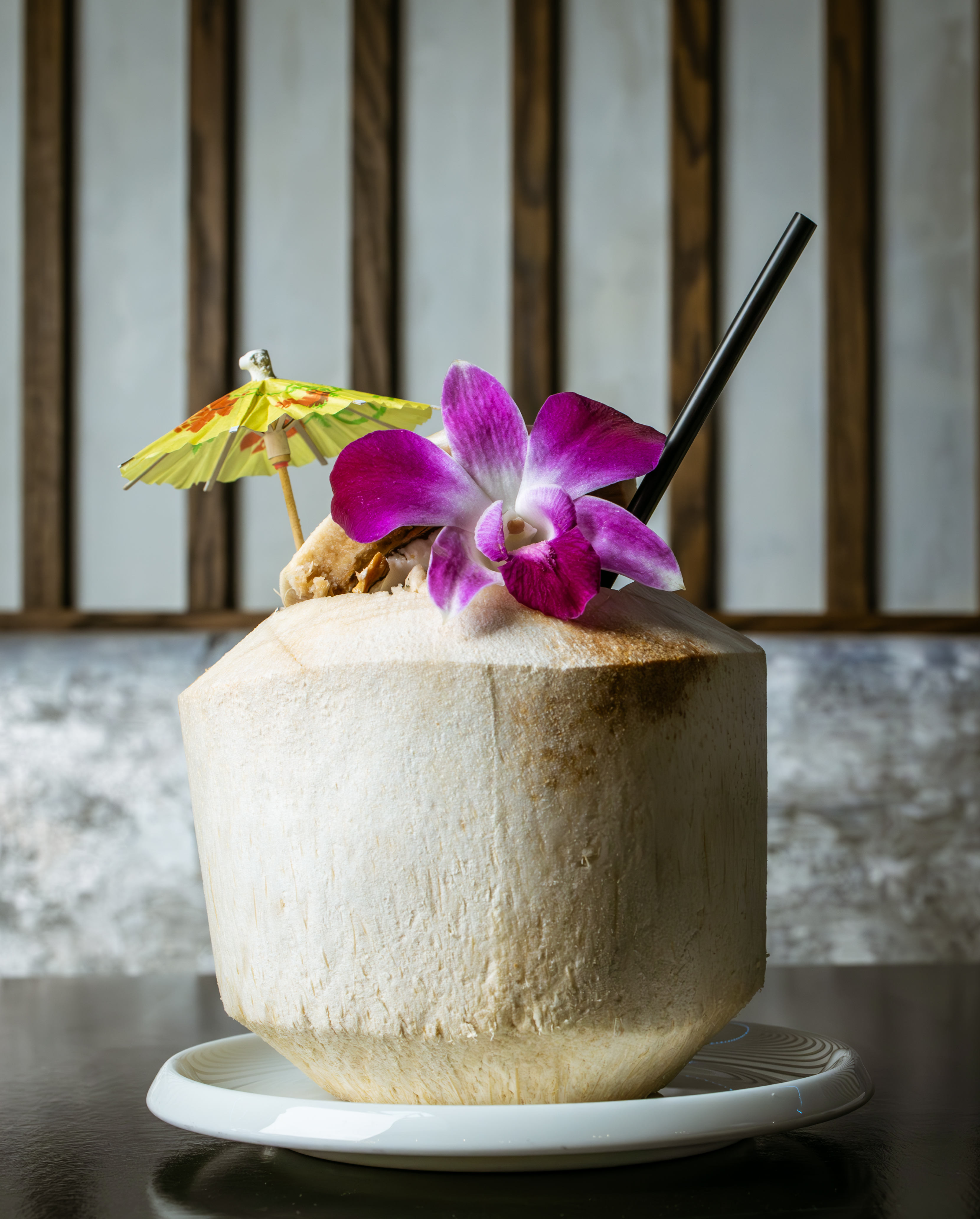 a coconut with a flower on the top