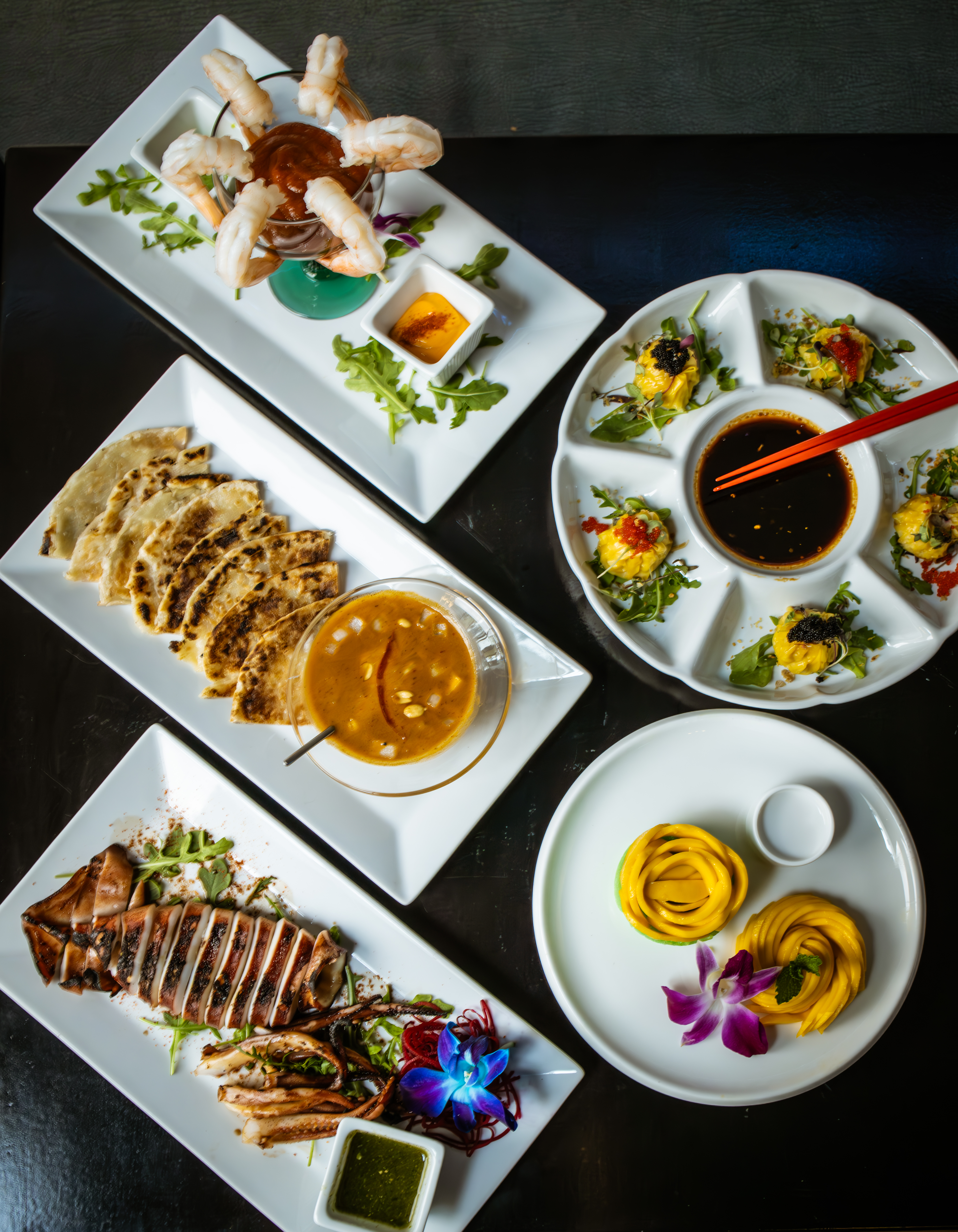 a box filled with different types of food on a plate
