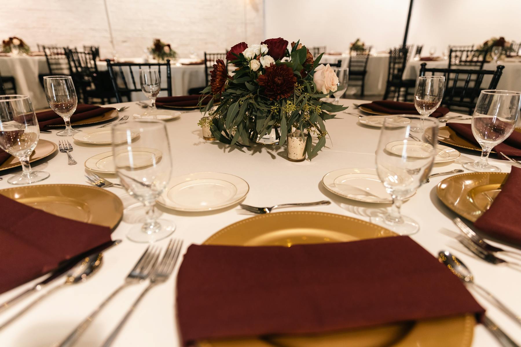 a dining table with wine glasses
