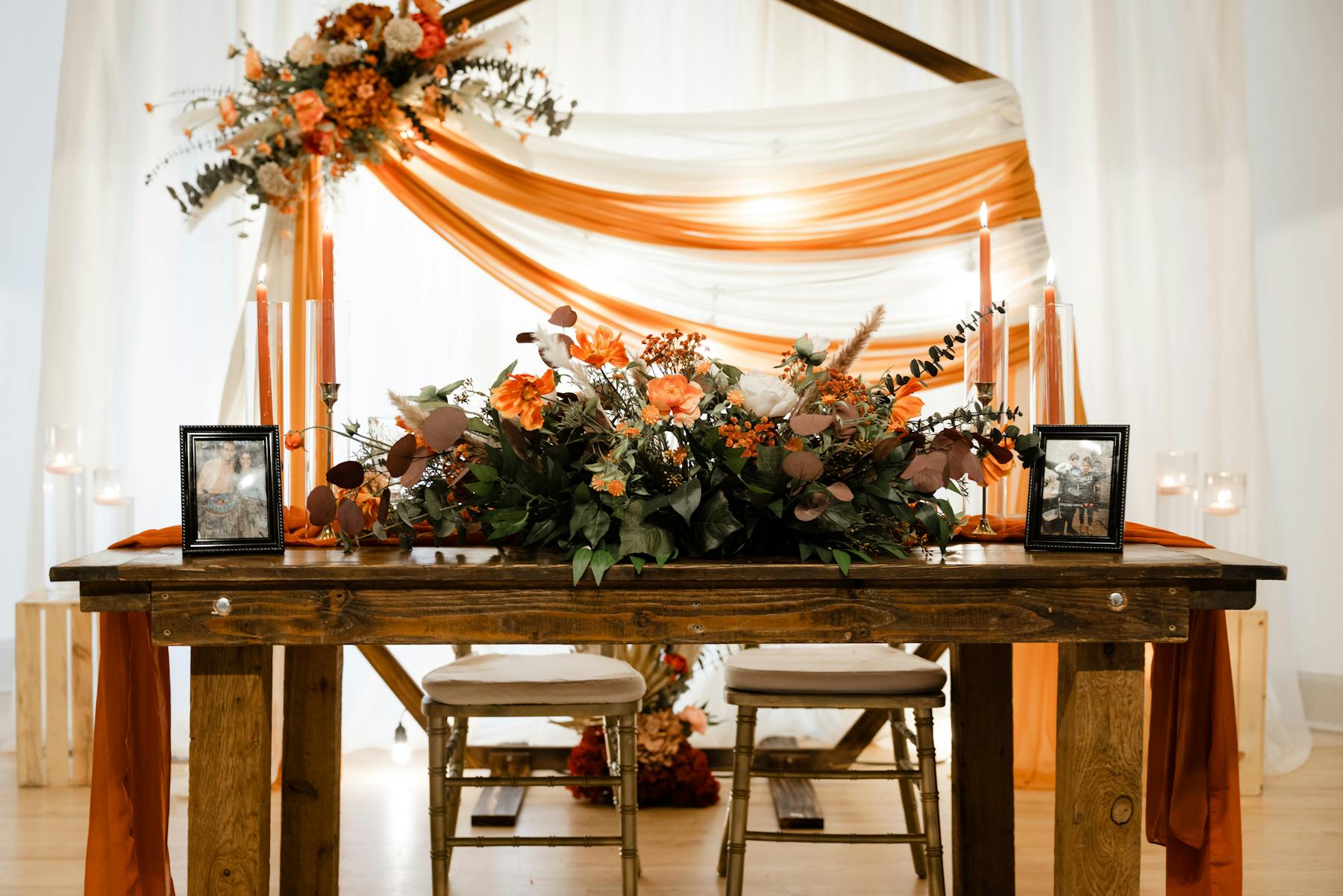 a room filled with furniture and vase of flowers on a table