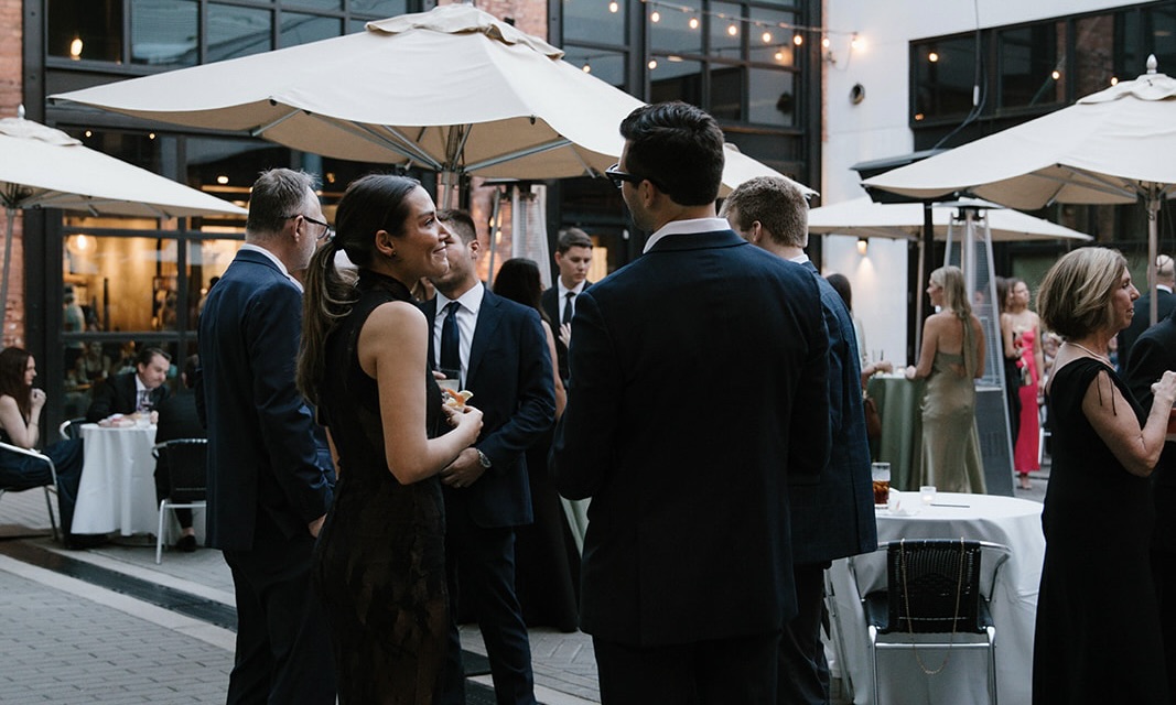 a group of people standing in front of a building