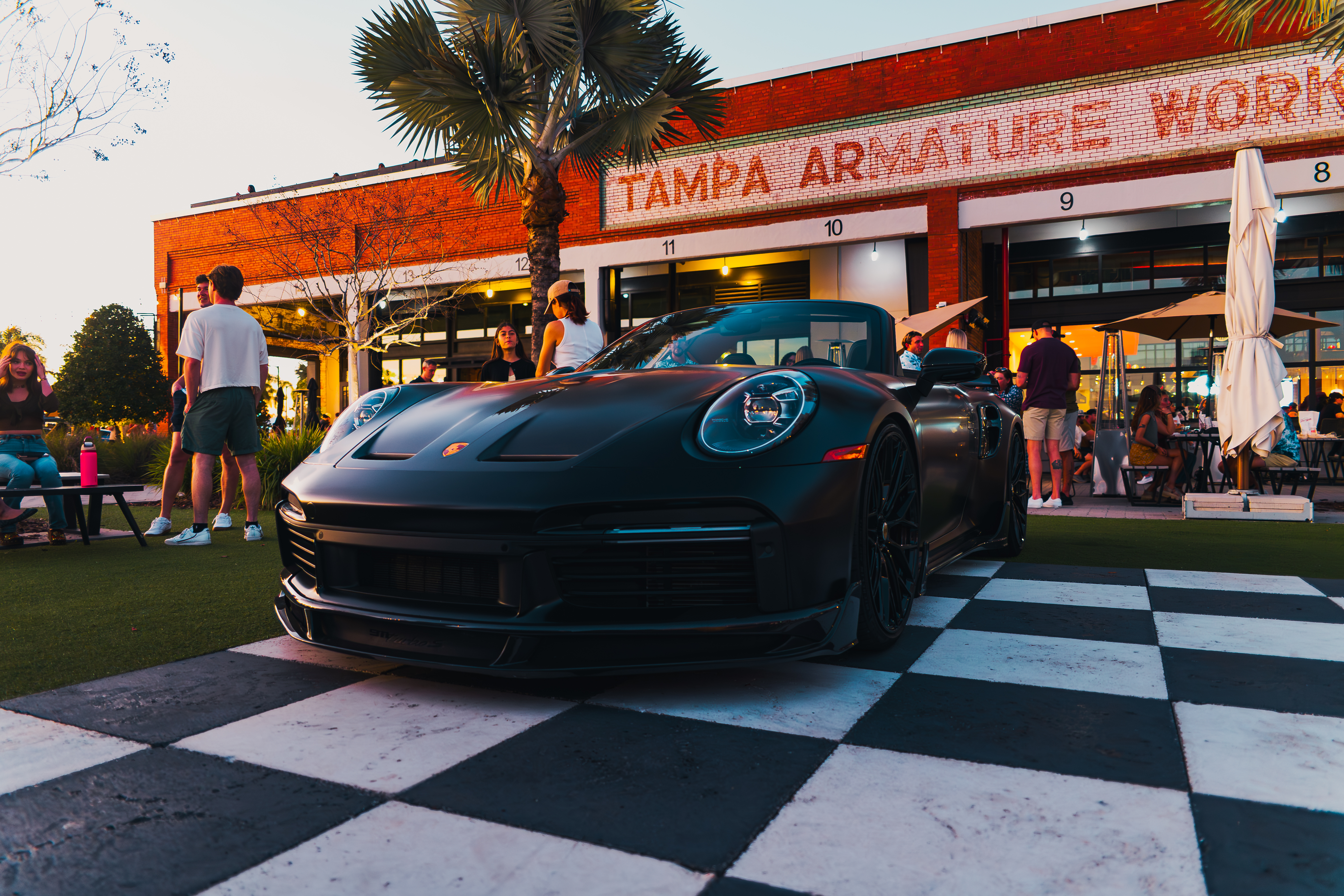 a black sports car parked outside a building