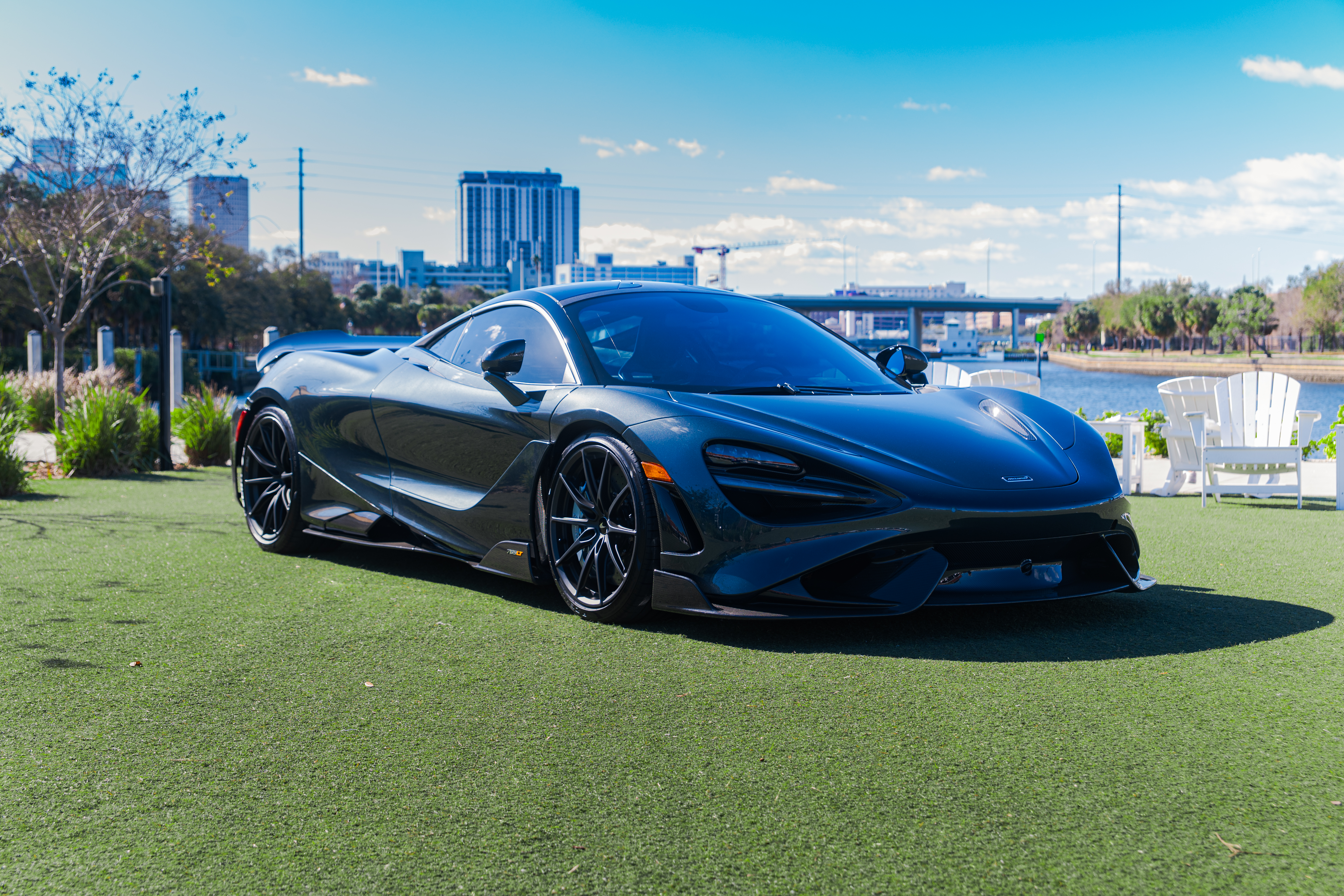 a black sports car parked on grass