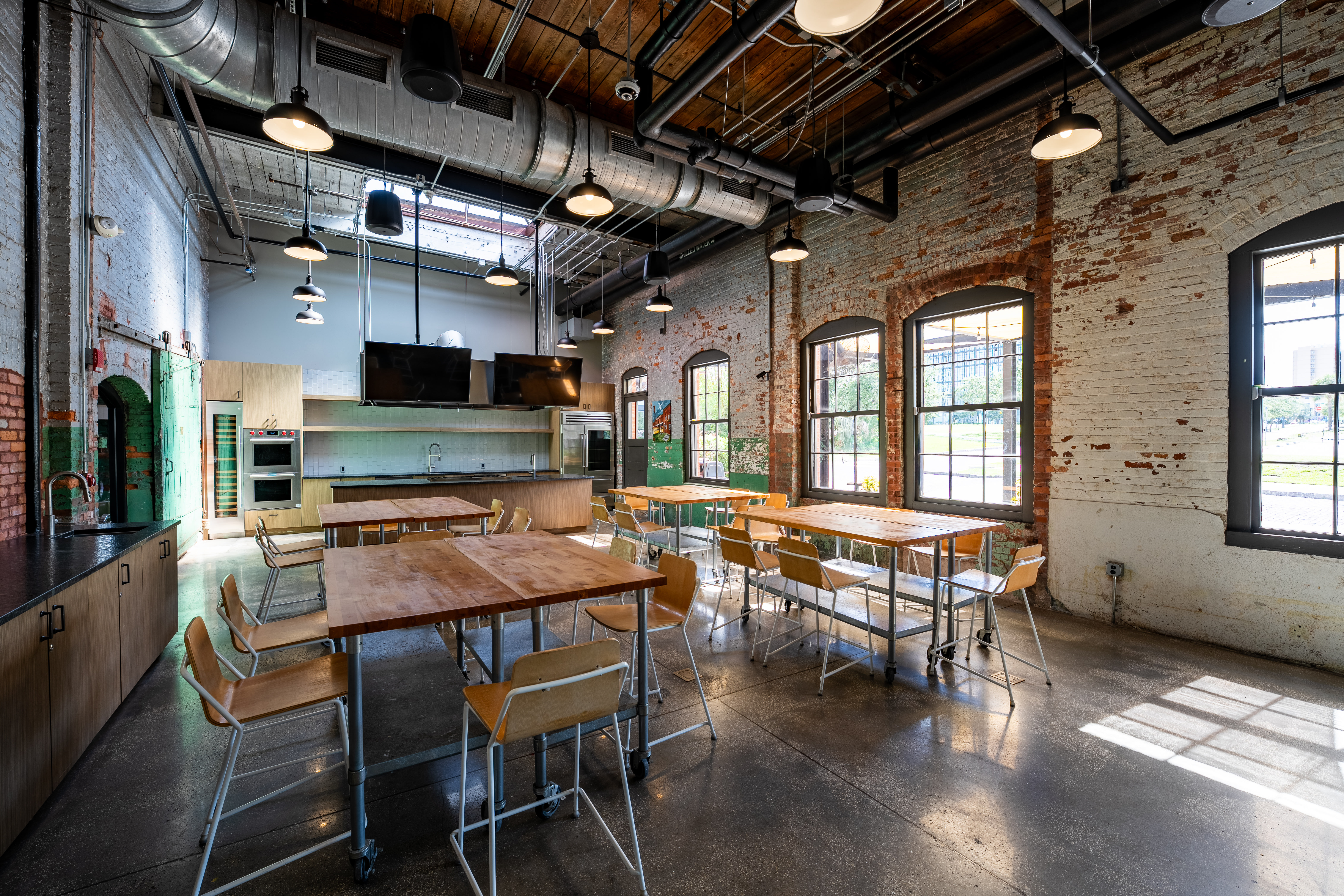 a room filled with furniture and a large window