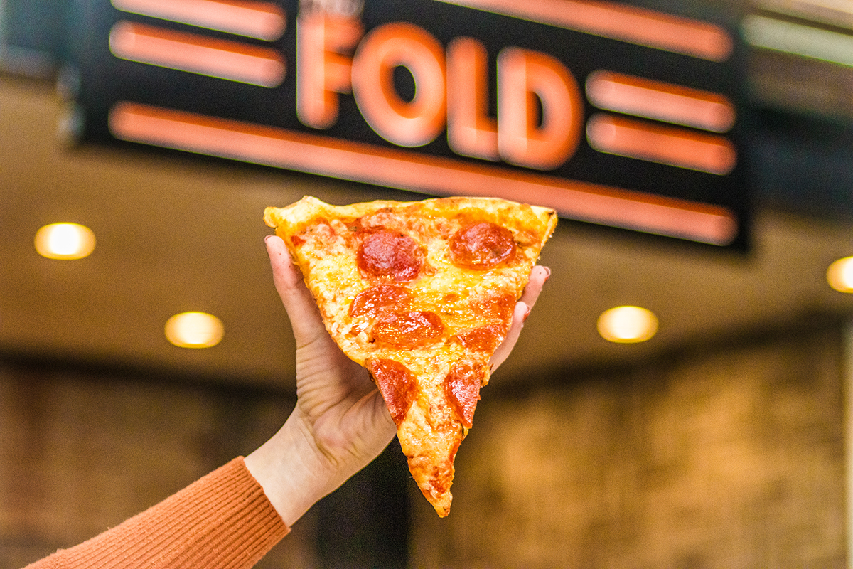 a close up of a slice of pizza