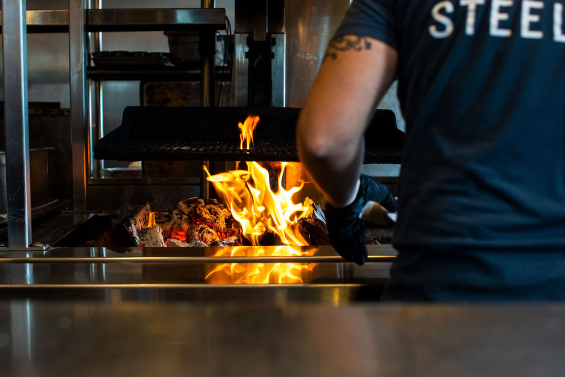 a man cooking food on a table