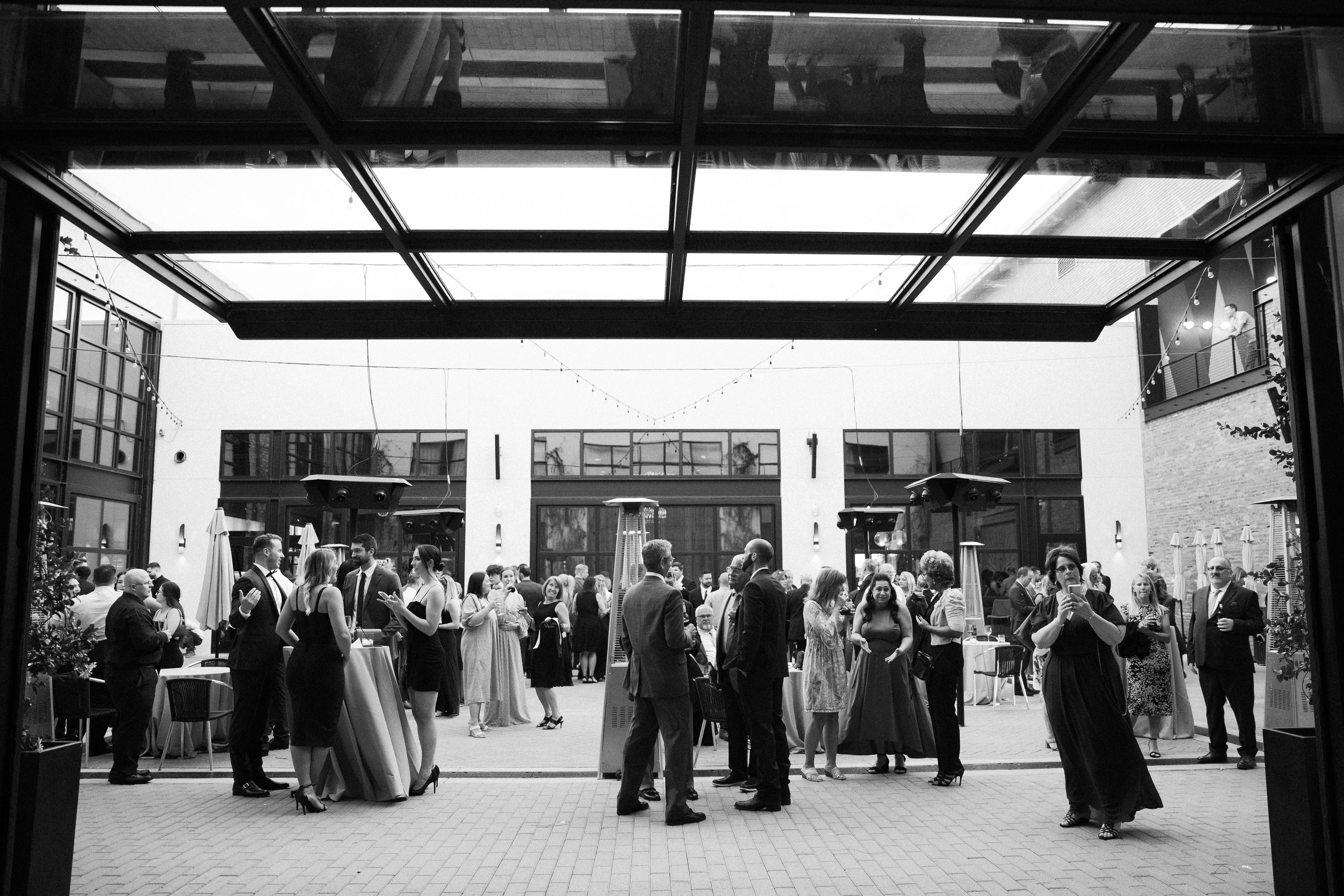 a group of people standing in a train station