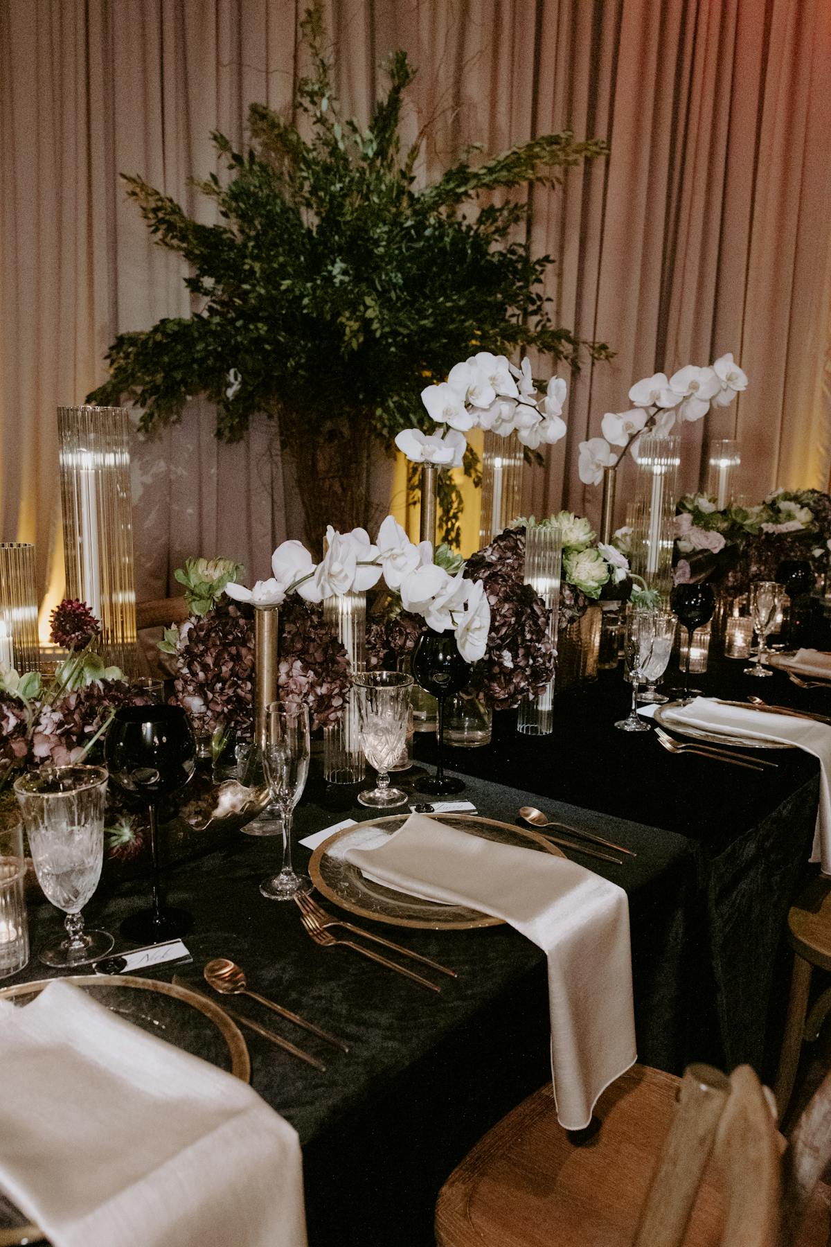a room filled with furniture and vase of flowers on a table