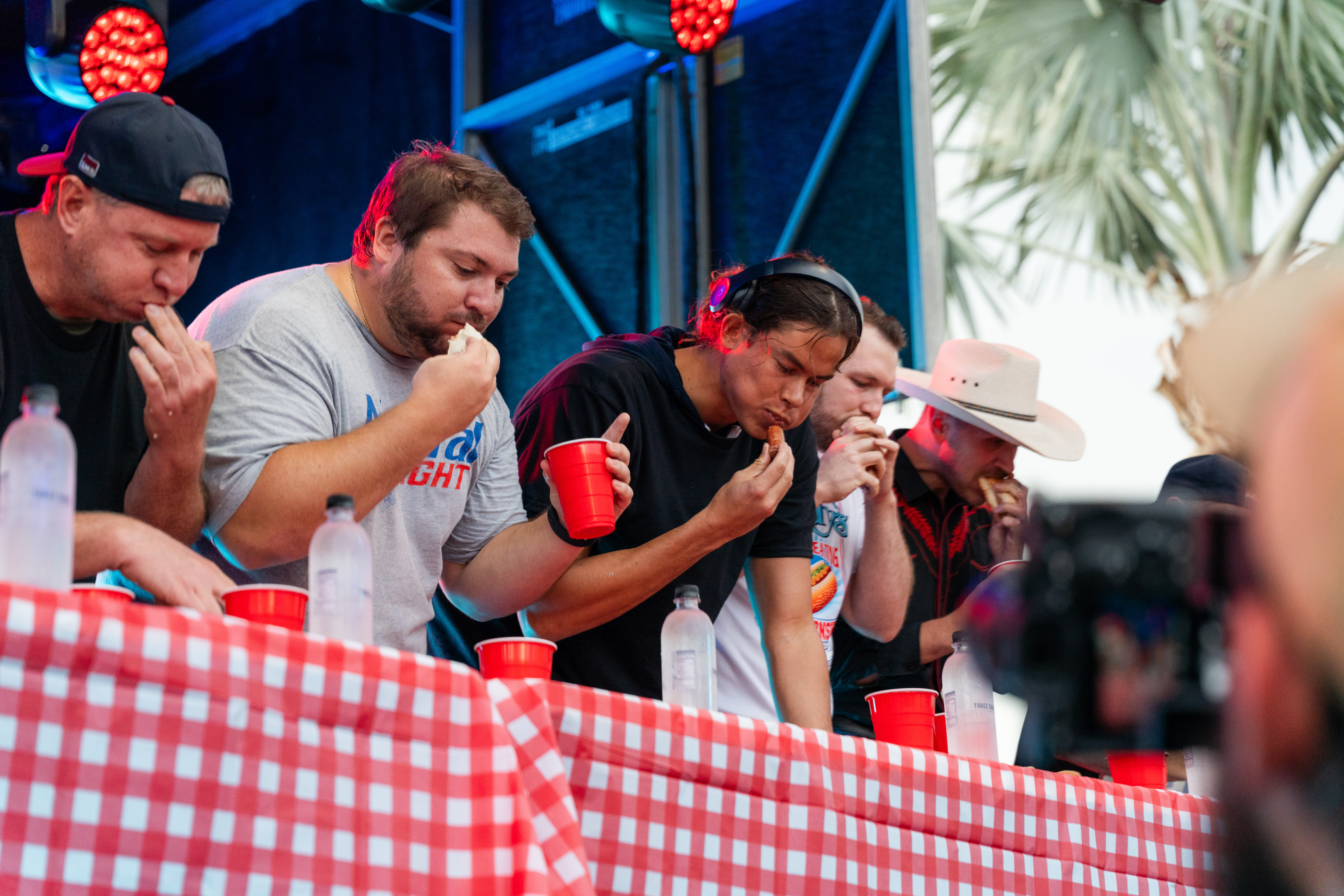a group of men eating at a table