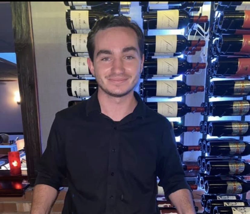 a man standing in front of a store