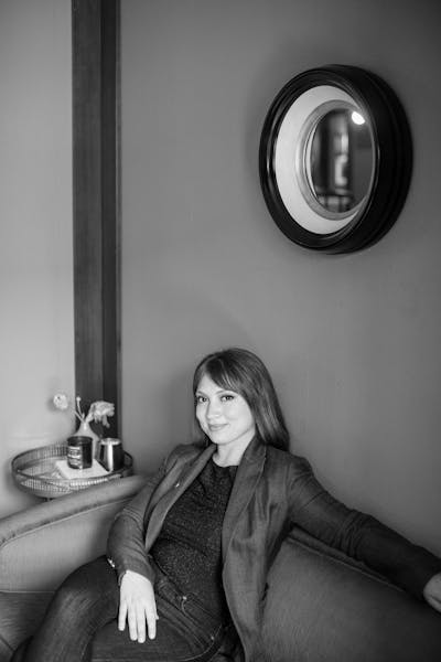 a person standing in front of a mirror posing for the camera