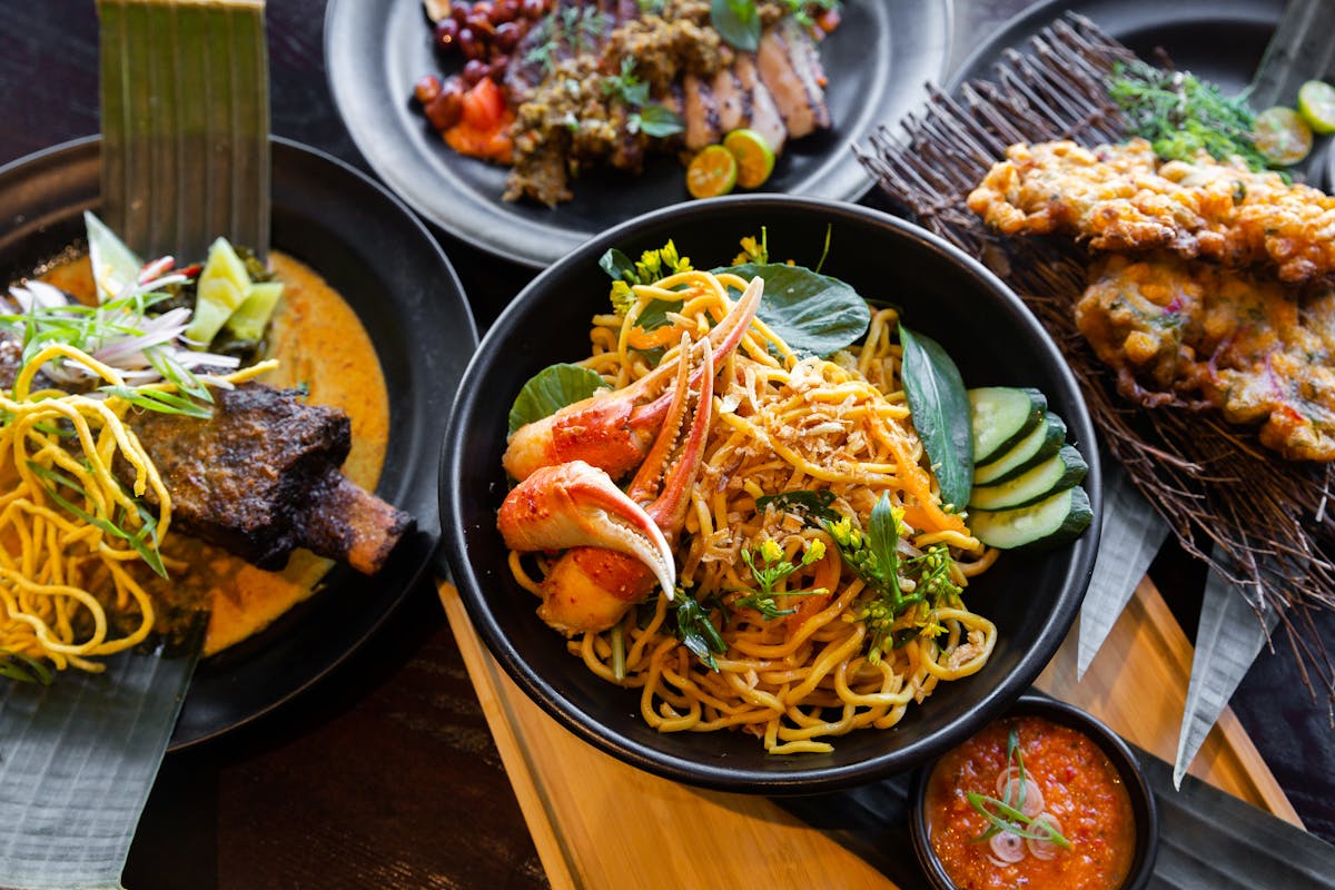 bowls and plates of modern indonesian food