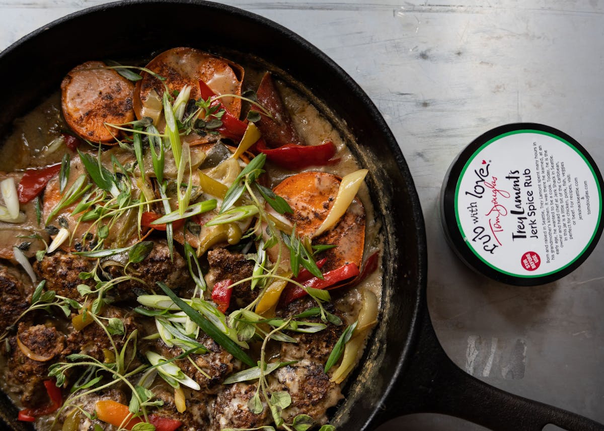 a pan filled with meat and vegetables