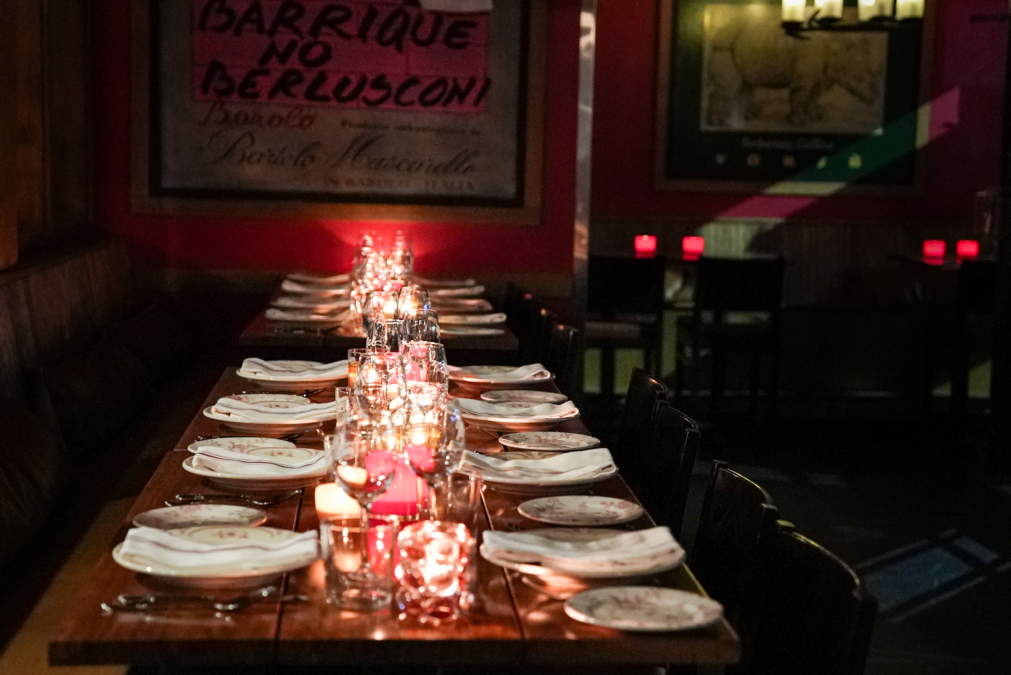 a table with plates and candles