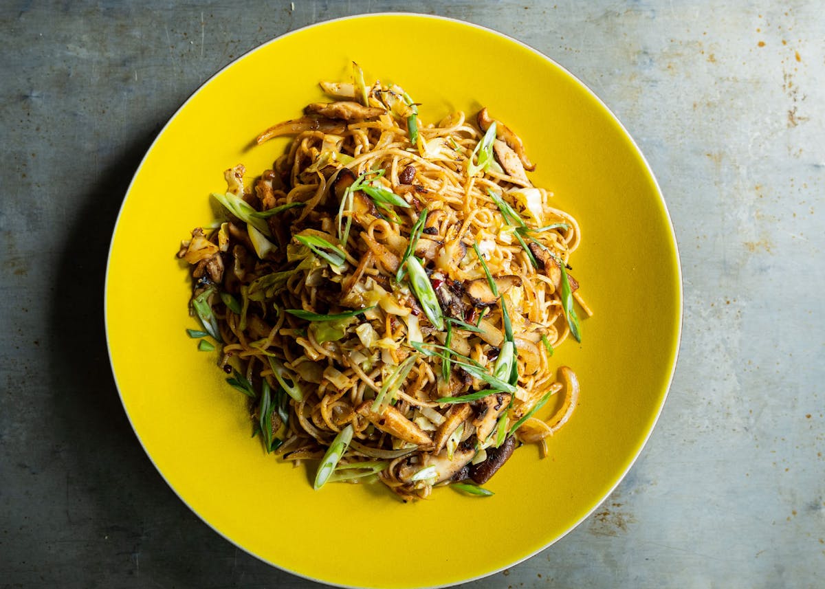 a bowl of food with broccoli