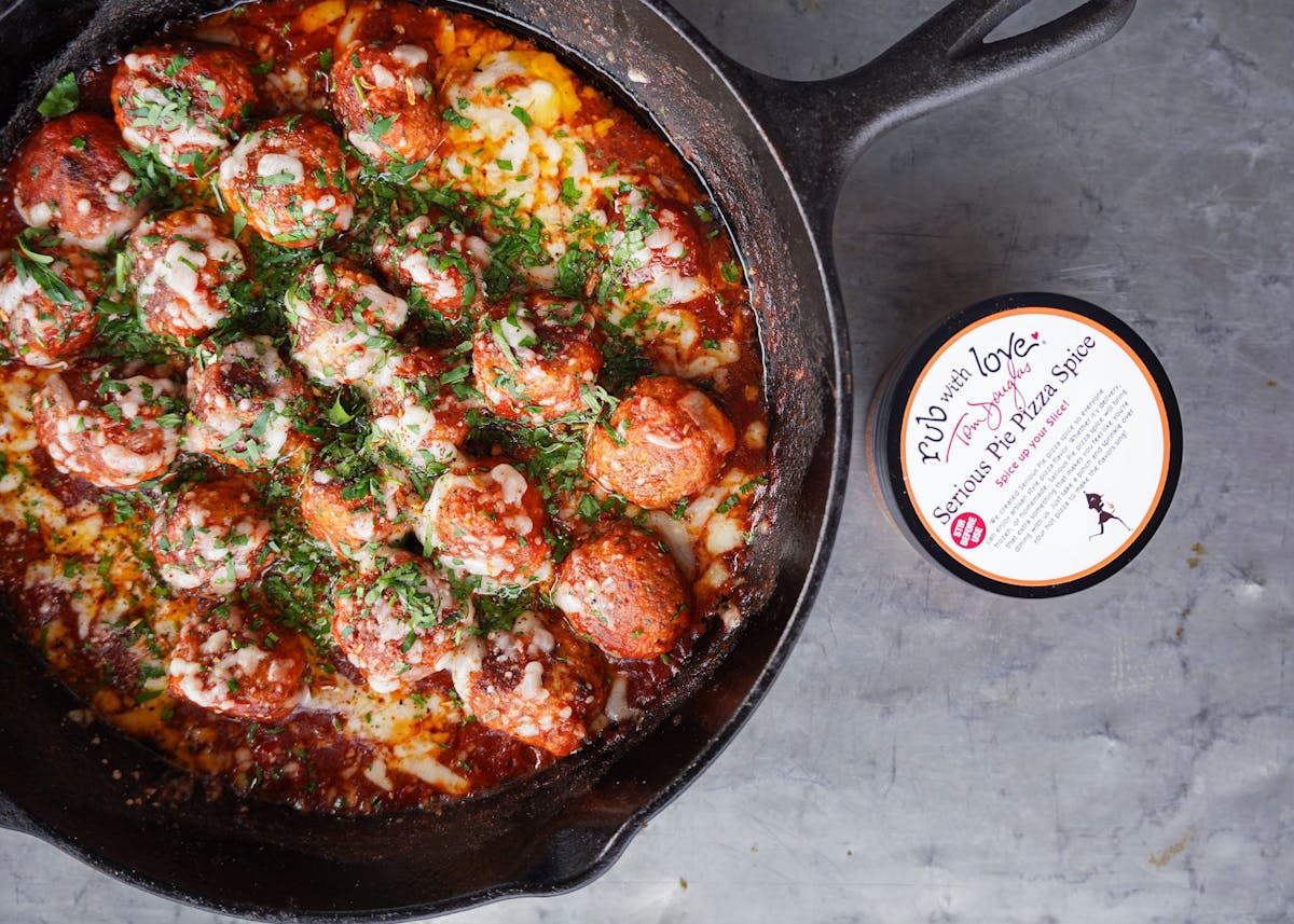 a pizza sitting on top of a metal pan