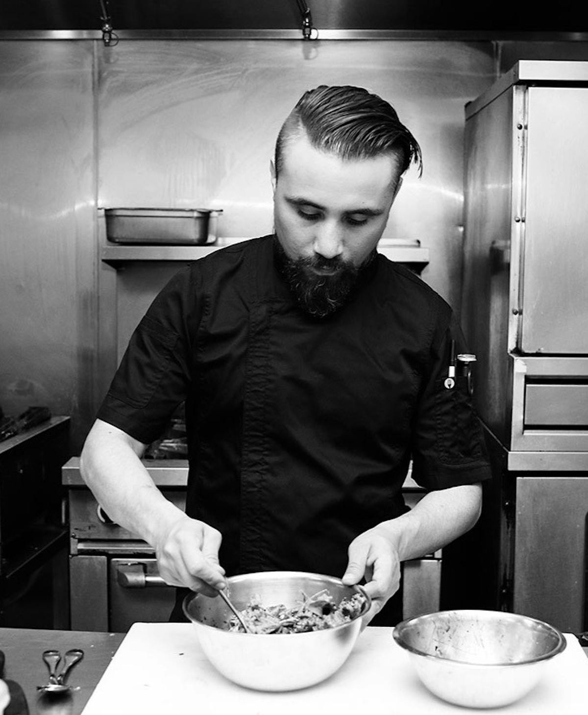 a boy is preparing food in a kitchen