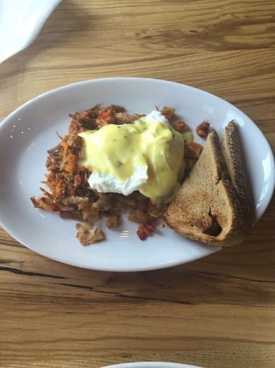 a plate of food on a wooden table