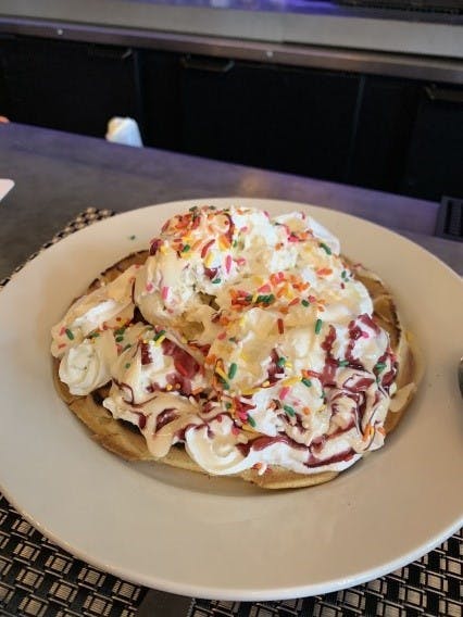 a pizza sitting on top of a white plate