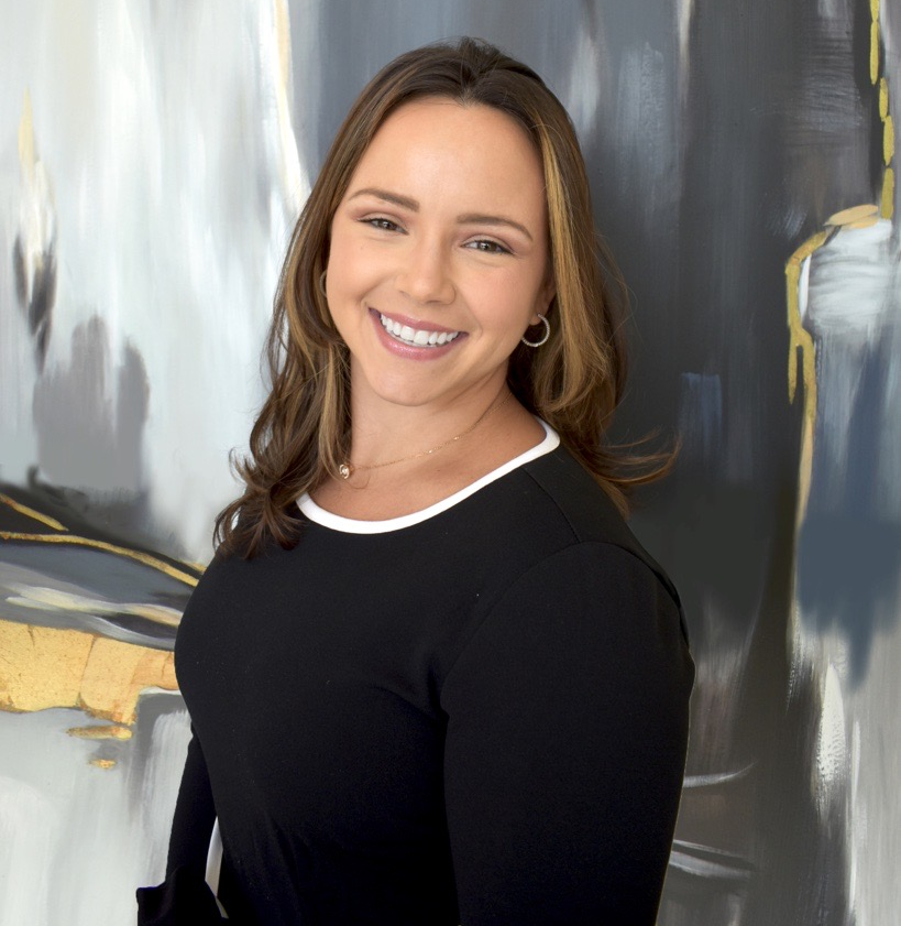 a person standing in front of a curtain