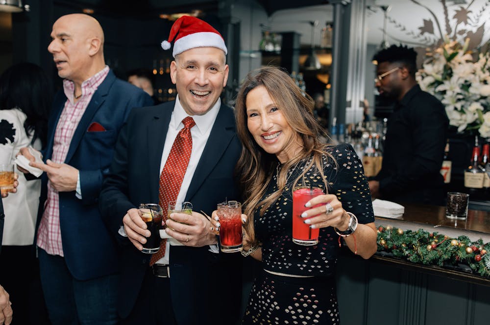 a group of people holding wine glasses