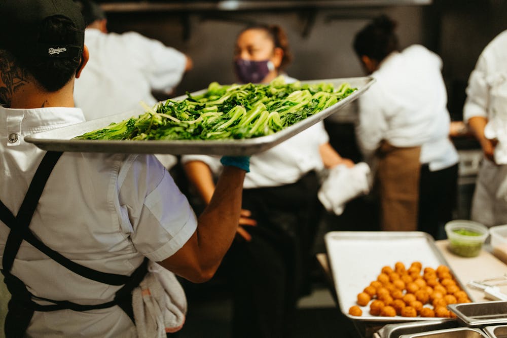 a person cutting food on a table