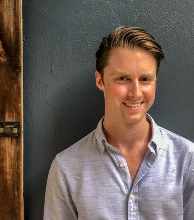 a man smiling for the camera