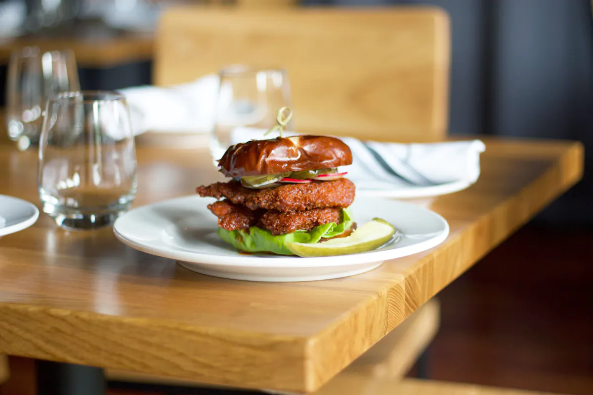 a plate of food sitting on top of a wooden table