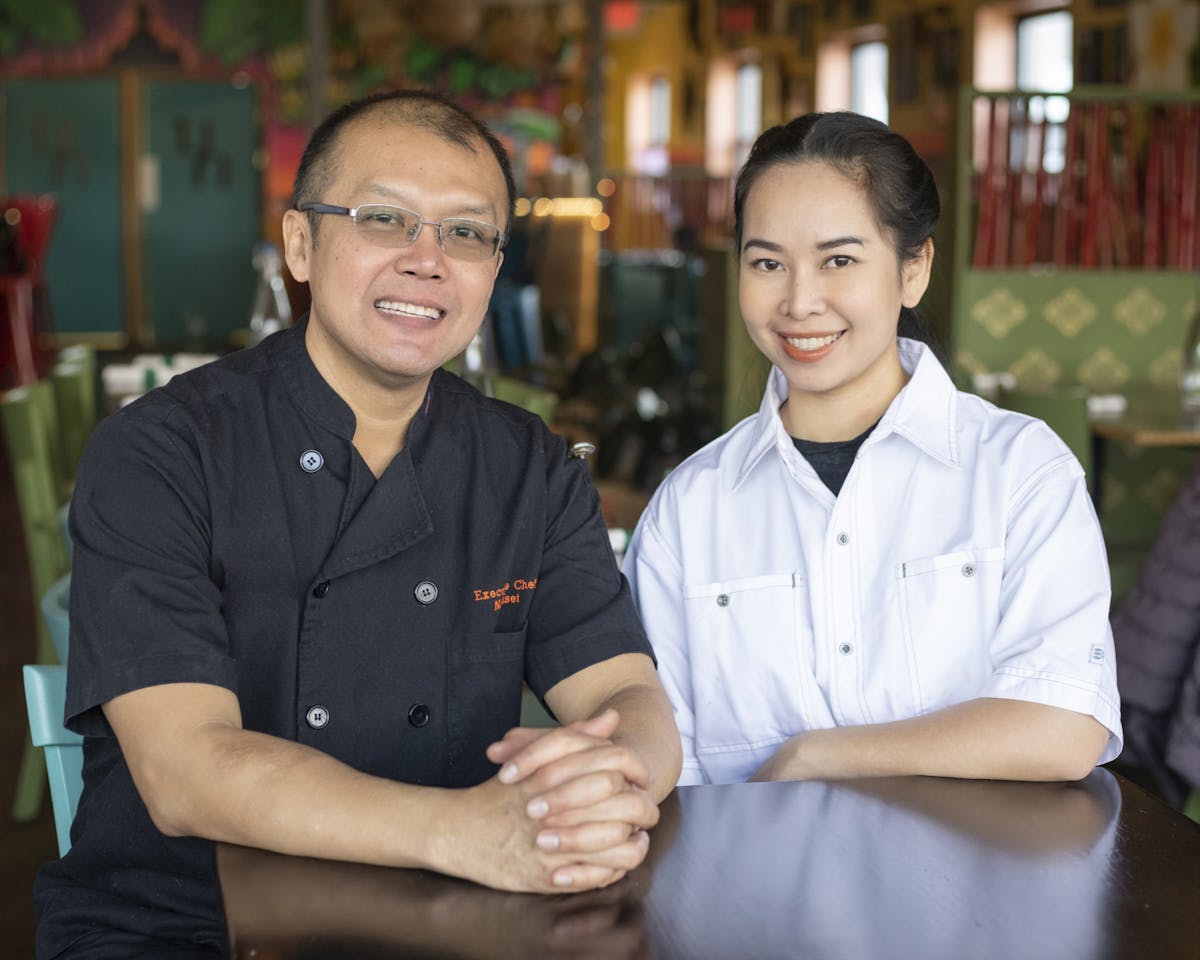two people sitting posing for the camera