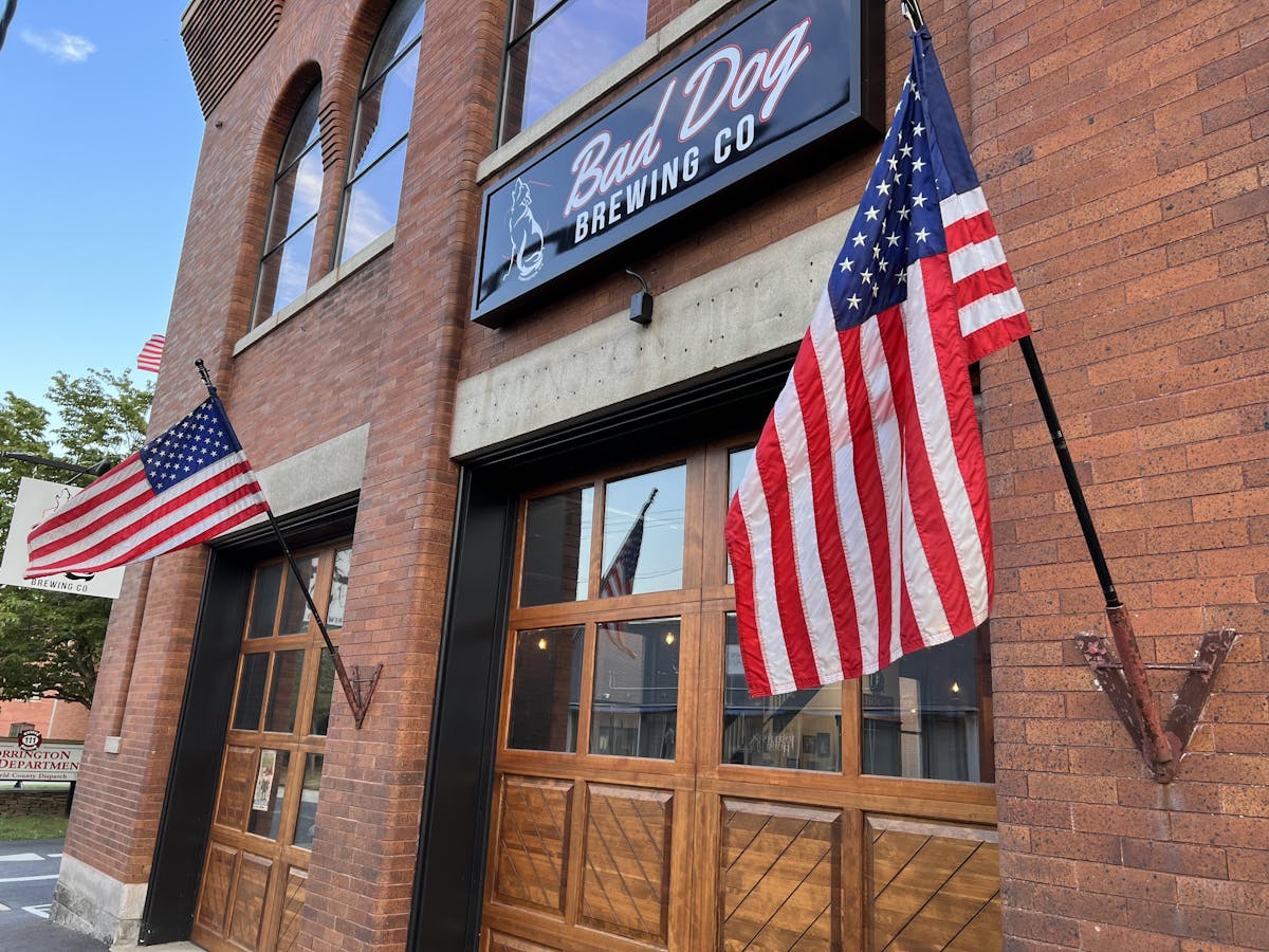 a flag hanging on a brick building