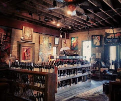 a room with shelves of wine
