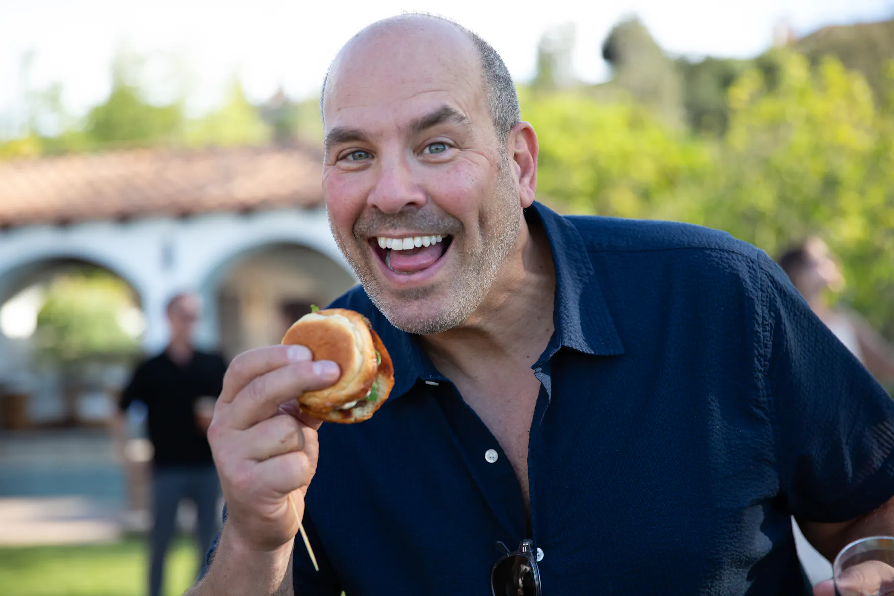 a man holding a burger