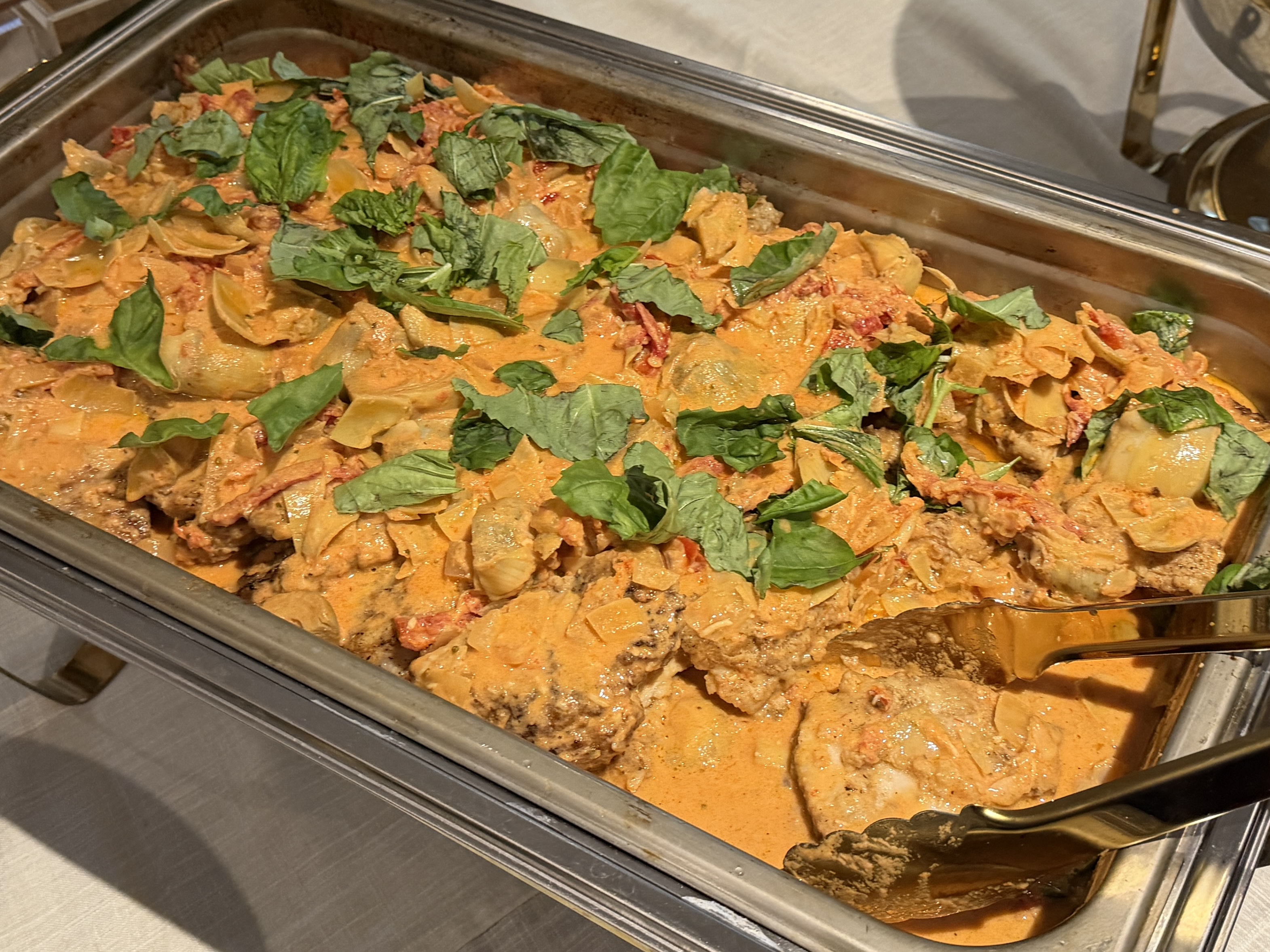 a tray of food with a spoon