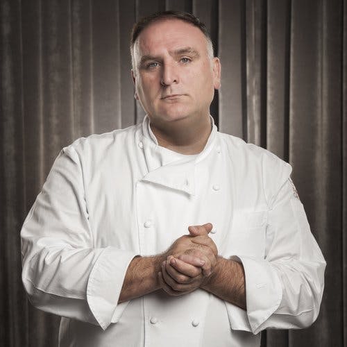 Jose Andres standing in front of a curtain