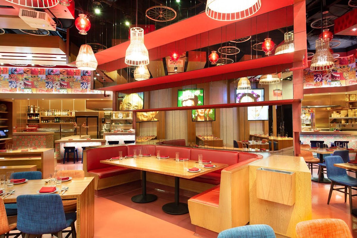 a group of people sitting at a table in front of a store