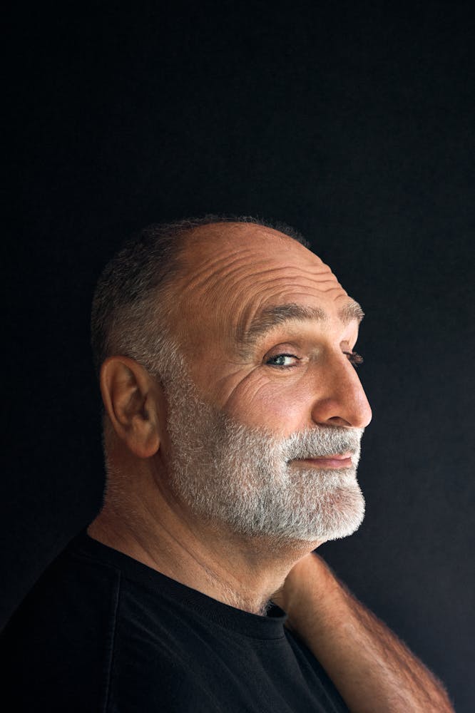 Jose Andres standing in front of a curtain